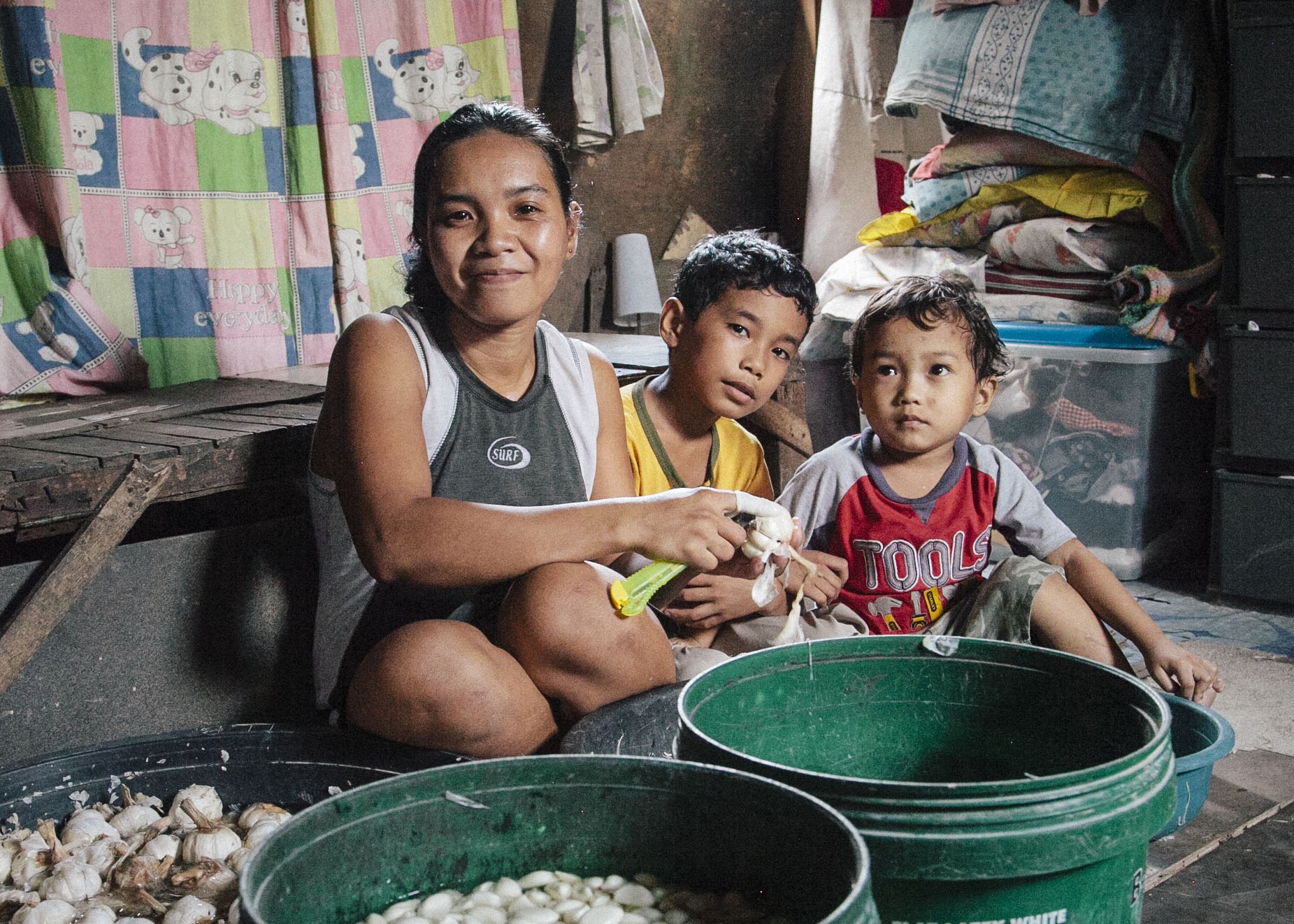 Rowena does her best to take care of her sons by selling garlic for food money.